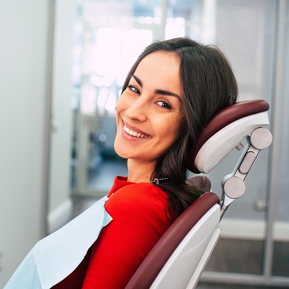Woman smiling while relaxing in treatment chair