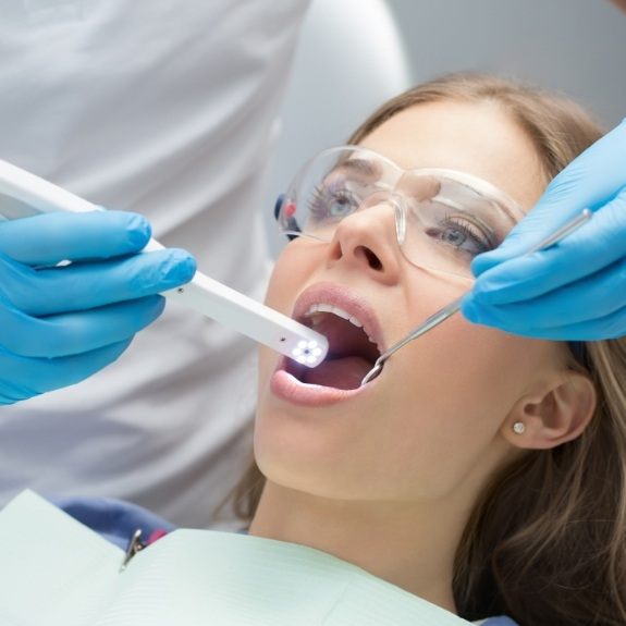 Dentist capturing smile photos with intraoral camera