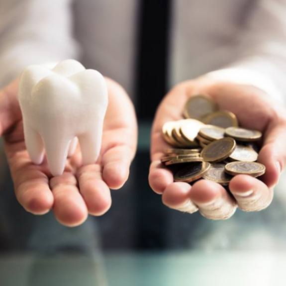 Coins balanced with a tooth