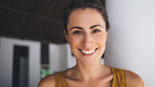Woman in a brown ponytail smiling