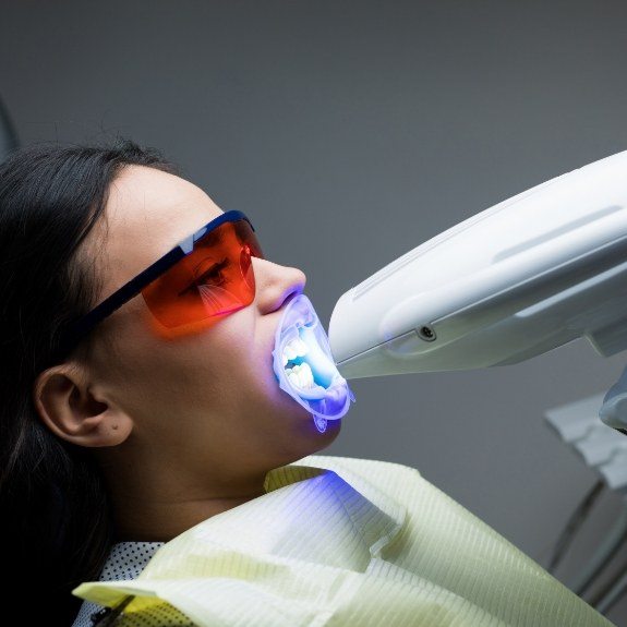 Dental patient receiving teeth whitening