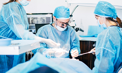 Dental team performing dental implant surgery