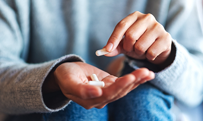 Person taking a pill
