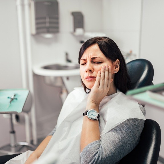 Woman in pain before emergency dentistry