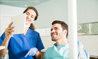 Dentist explains something to patient