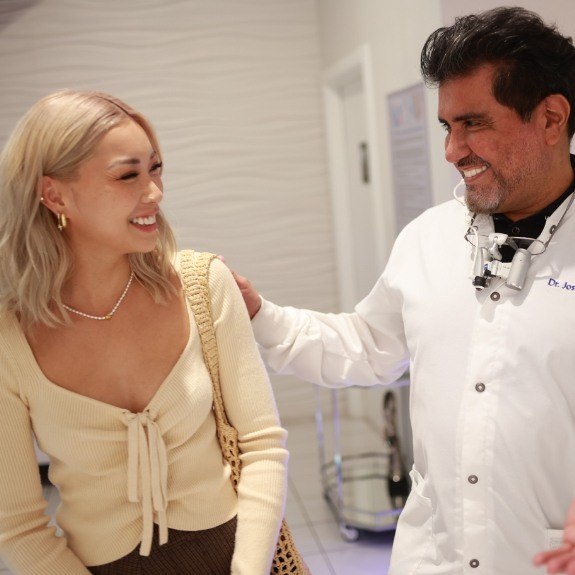 Dentist smiling at dental patient