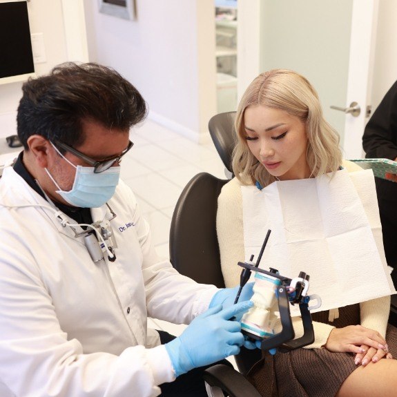 Dentist explaining dental treatment to dentistry patient