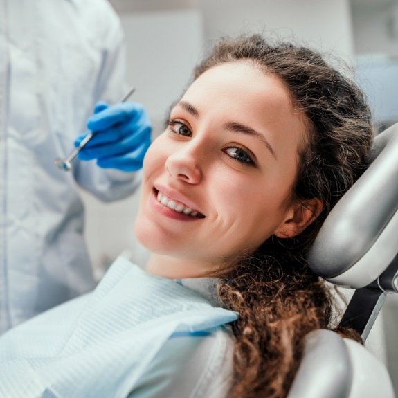 Woman smiling during preventive dentistry checkups and teeth cleanings