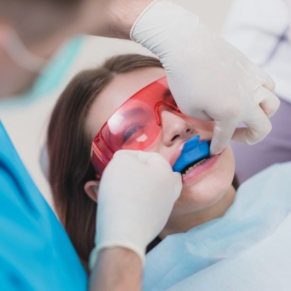 Dental patient receiving fluoride treatment