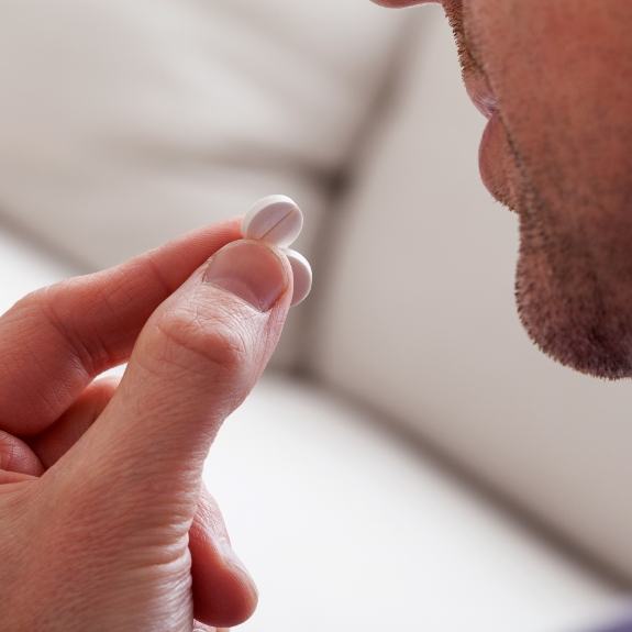 Patient taking oral conscious sedation dentistry pill