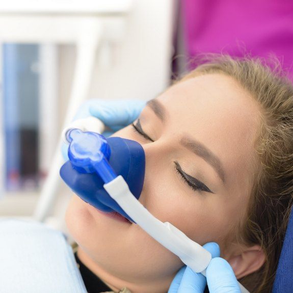 Woman receiving nitrous oxide dental sedation