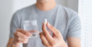 Dental patient taking sedation dentistry pill