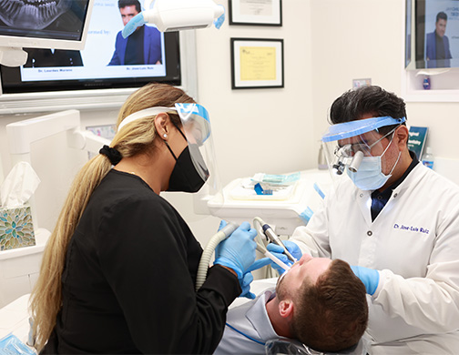 Burbank dentist and dental team member treating a patient