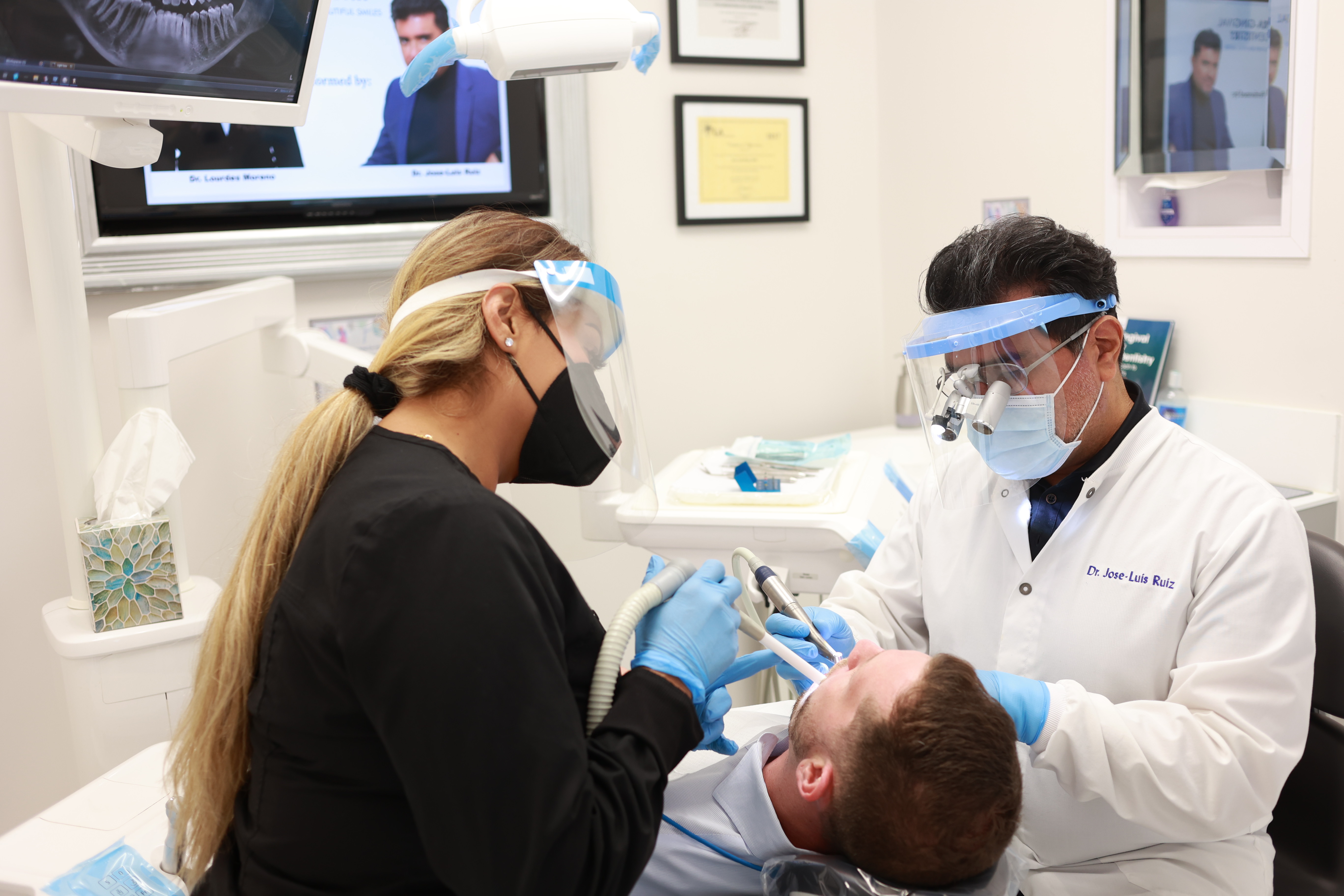Studio City dentist and dental team member treating a patient